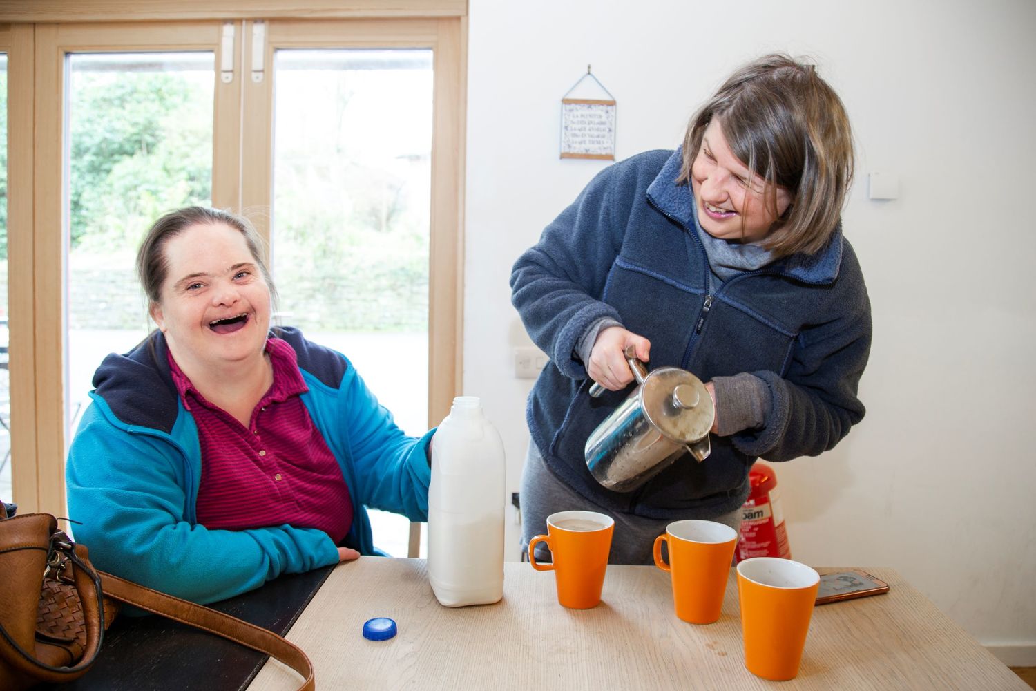 One of our support workers and people we support at a Camphill Village Trust community