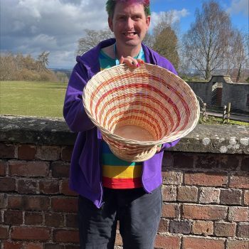 Someone holding a woven basket