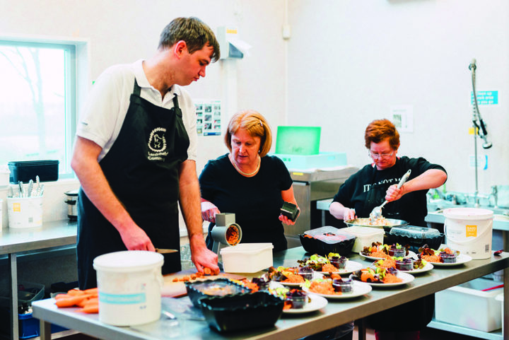 Michael helps in the kitchen at Larchfield Community