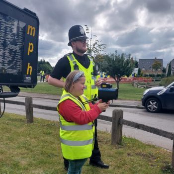 Zara checks the speed of passing motorists