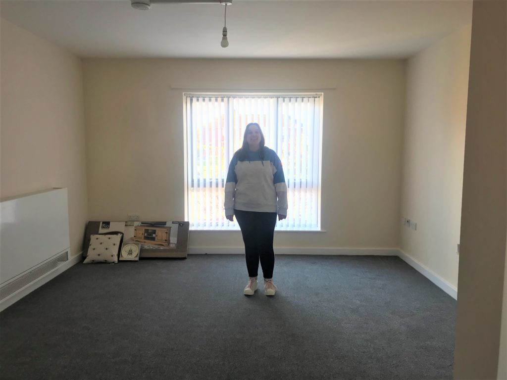 Steph in the living room of her new home