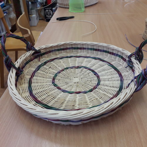 David's handwoven tray. Lady making Christmas crafts and is smiling and happy