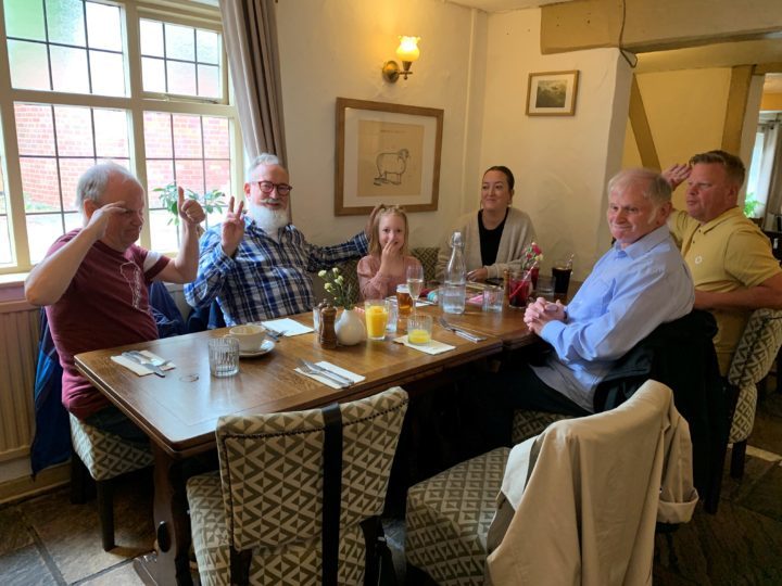 Shared Lives family enjoying a meal in a restaurant