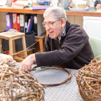 A person we support in a craft workshop
