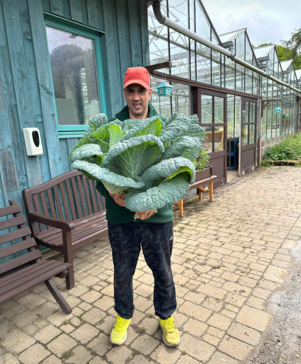 Our adult social care services. One of the people we support gardening