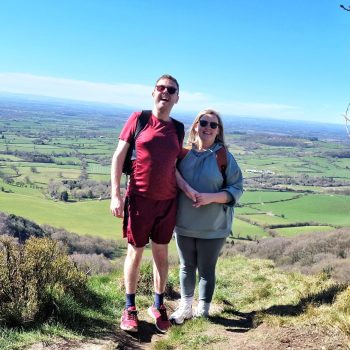 2 people standing in the countryside