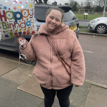 Hannah holding a balloon