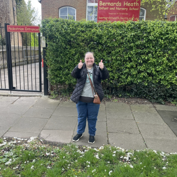 A person we support volunteering at a primary school