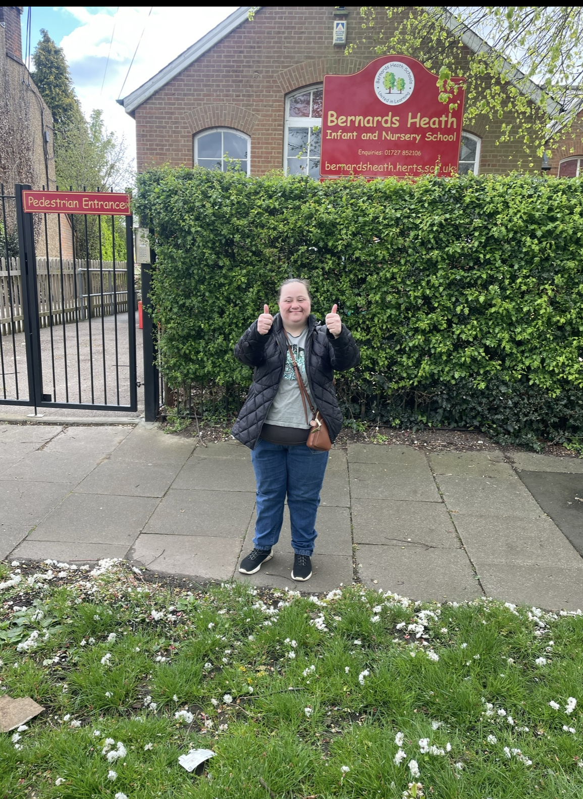 Hannah At School Front A person we support volunteering at a primary school