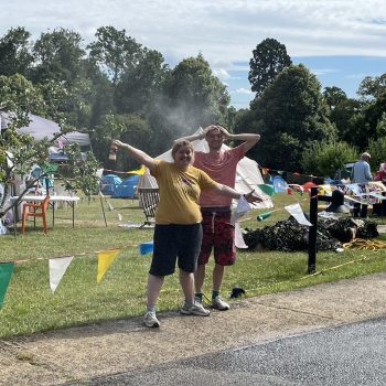 People smiling at a festival