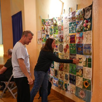People looking at our patchwork quilt