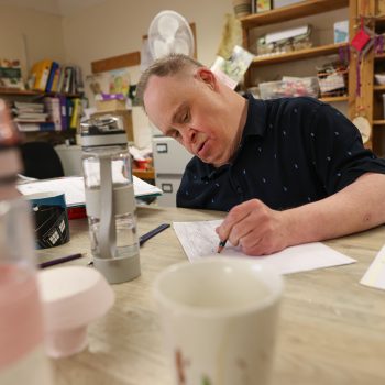 A person we support writing