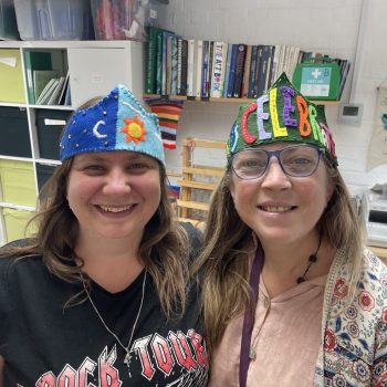 Two people we support wearing handmade felt crowns