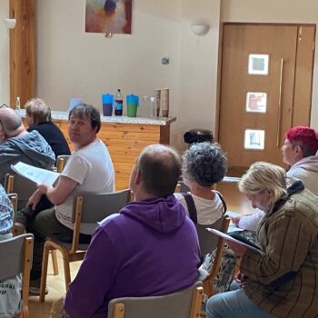 People sitting in a hall