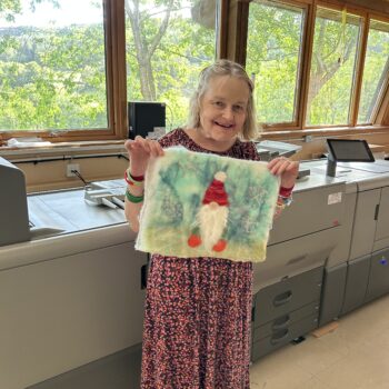 Katie holding her card