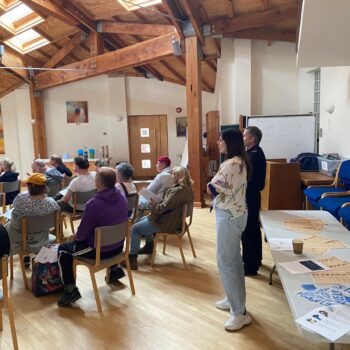 People listening to a presentation