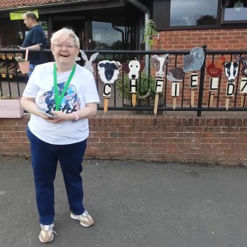 A person standing in front of a building