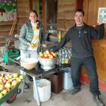 People apple pressing