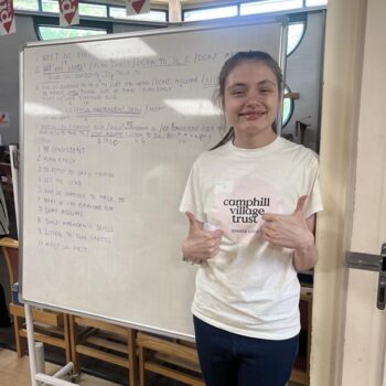 Katie standing by a whiteboard