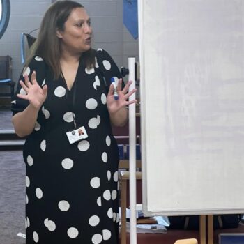 Reena giving a presentation