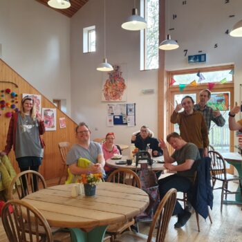 People smiling in a cafe
