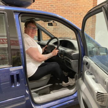 A person driving a car