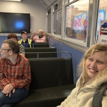 People smiling on a bus