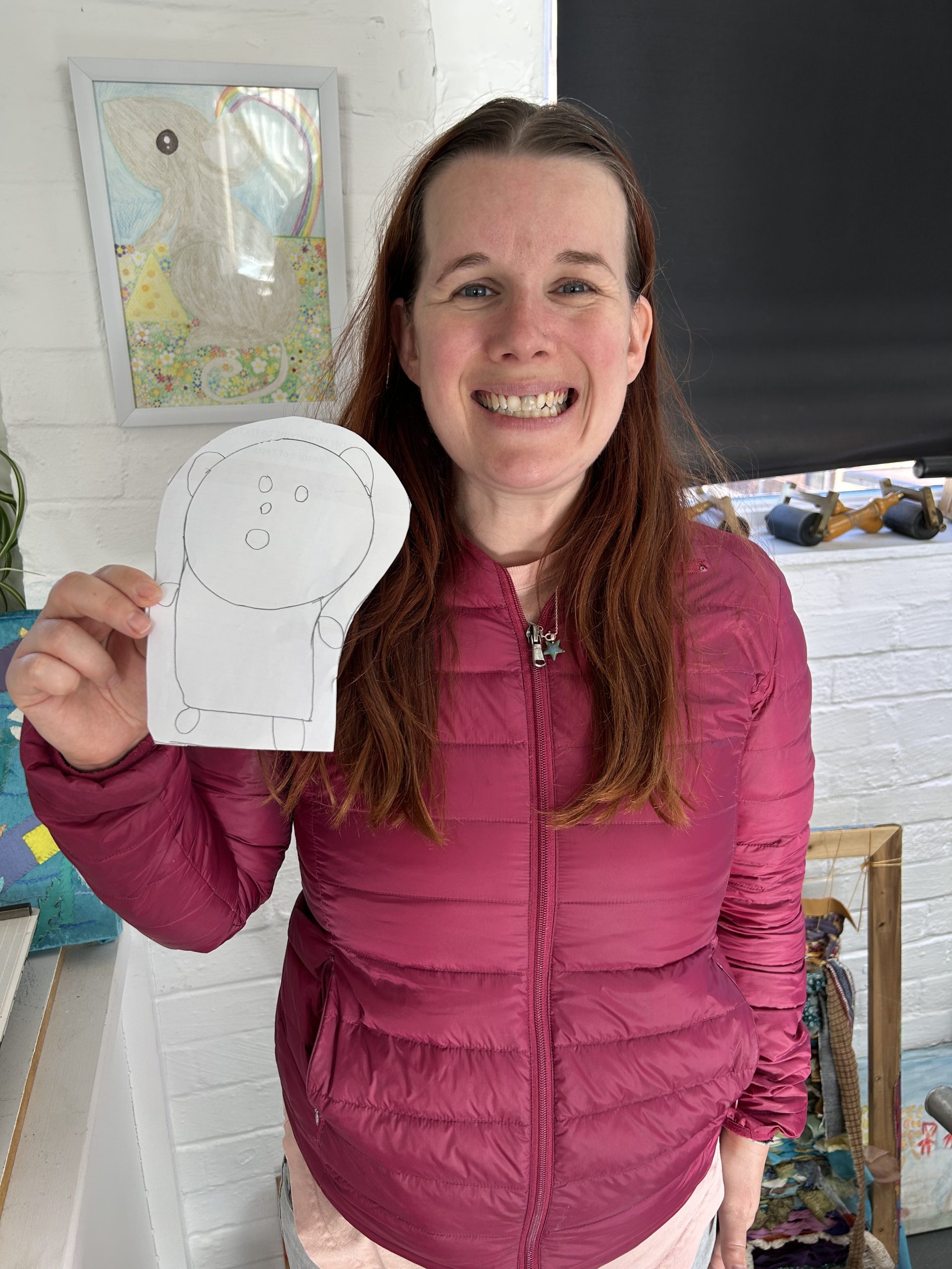 Nicki holding a drawing