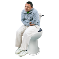 A man sitting on the toilet holding his tummy in pain.