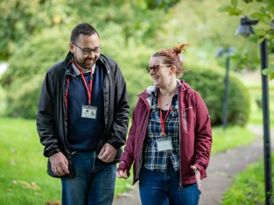 People we support standing next to a minubus