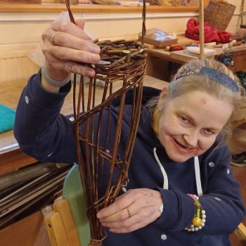 A person holding up willow