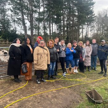 People standing together smiling in Ashfield Gardens