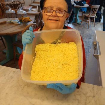 Someone holding up food that they have made