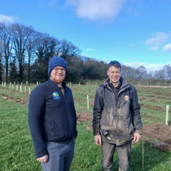 Two people standing outside