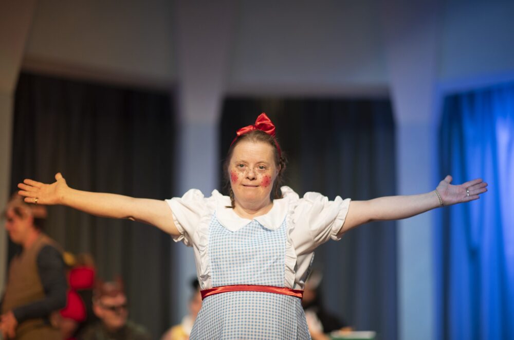 A person we support in a pantomime