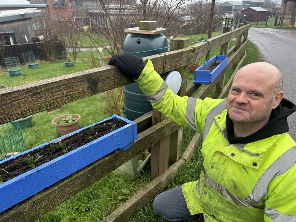 Michael gardening outside
