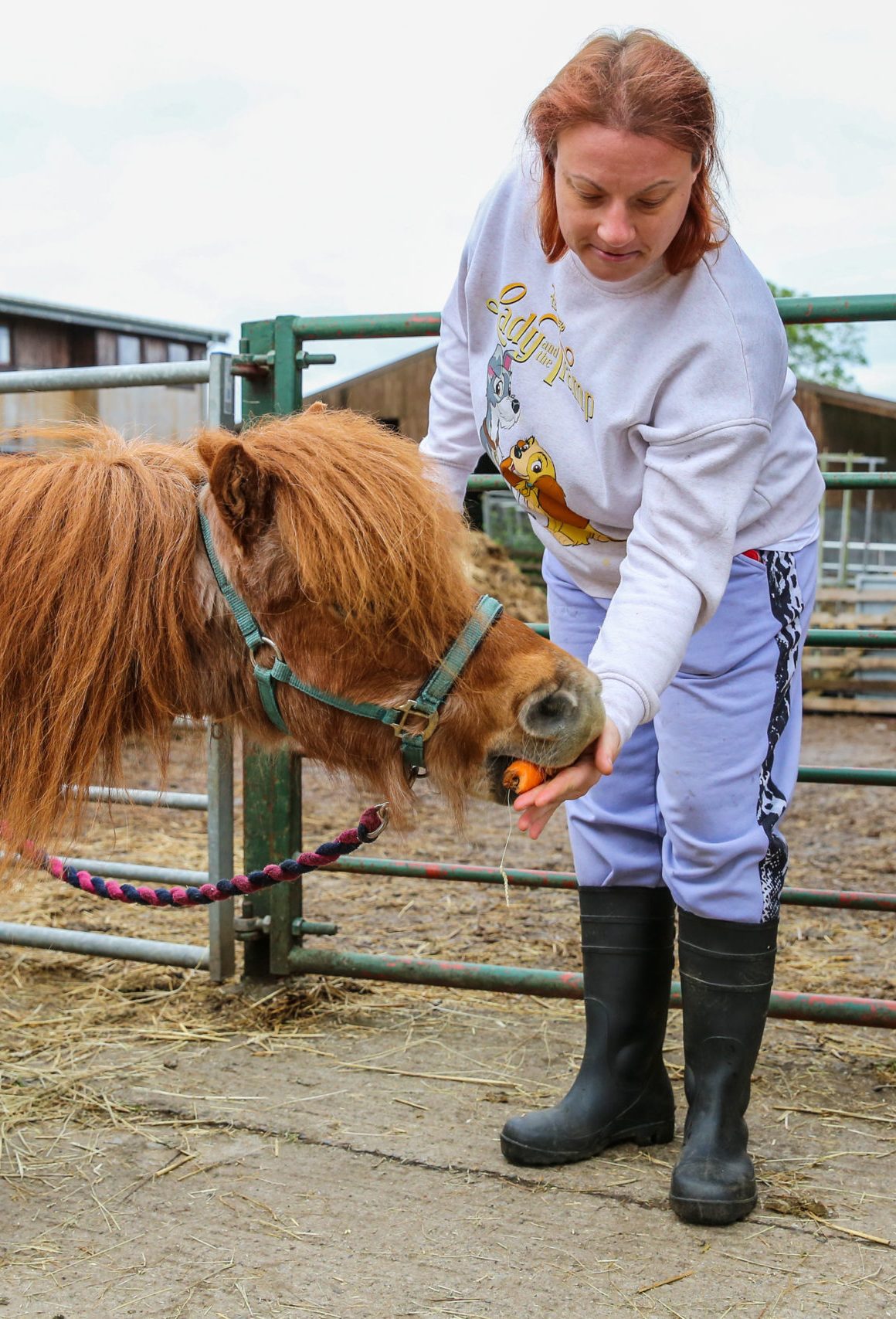 3 people cooking together in a kitchen and laughing in our Nature-based day activities
