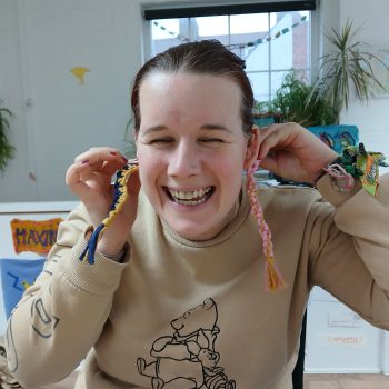 A person holding 2 keyrings