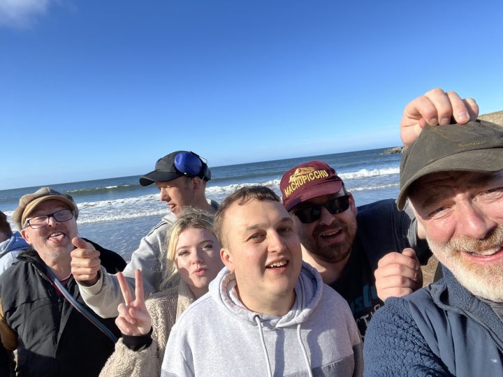 People smiling at the seaside