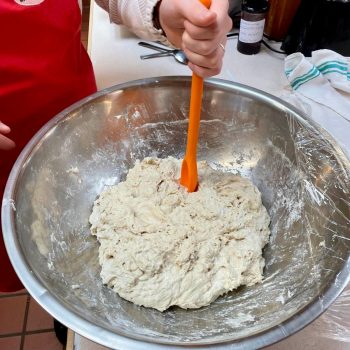 A person mixing with a spatula
