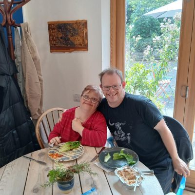 Two people smiling