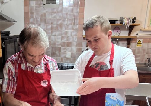 People cooking in a cafe