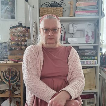 Sophie sitting in the creative studio