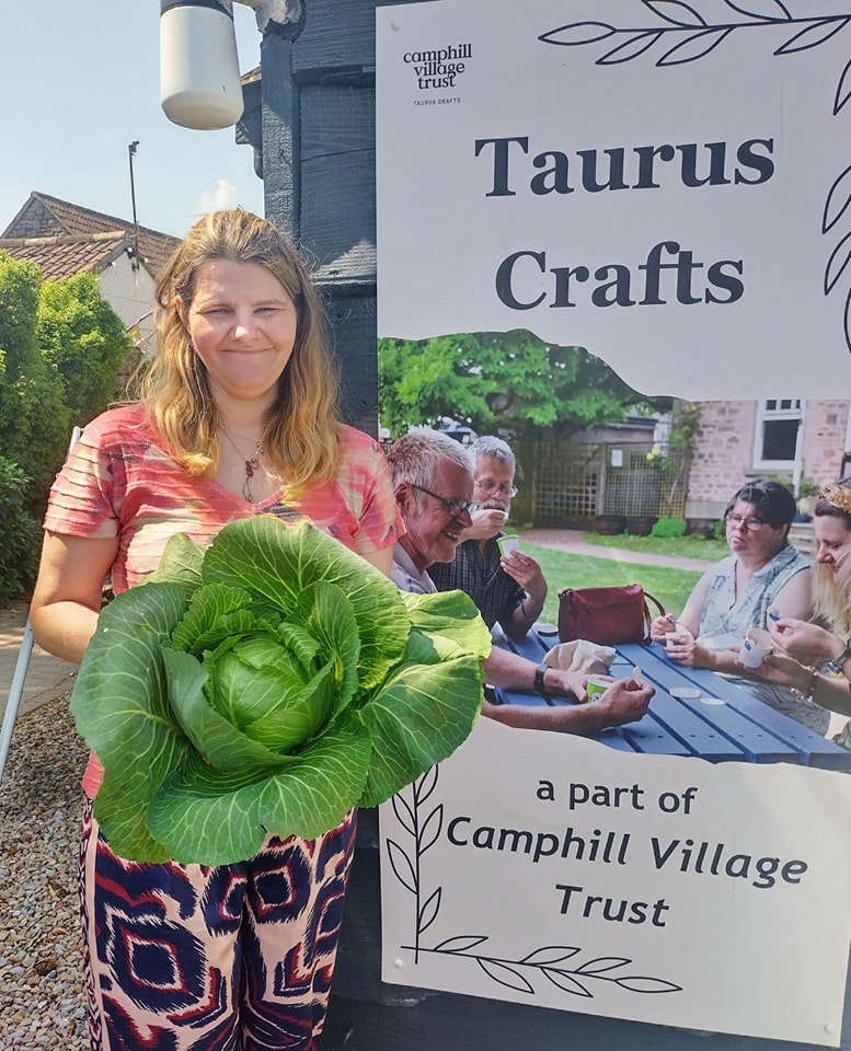 Harriet standing with a cabbage