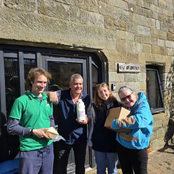 People standing with Botton cheese