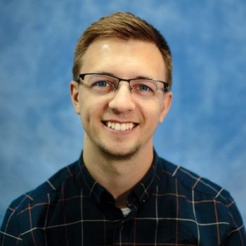 Headshot of Brent smiling at the camera