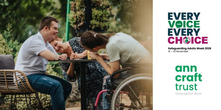 Three people sit together around an outdoor table in a garden setting. One person uses a wheelchair and is seated closest to the camera, while the other two sit opposite. Trees and greenery are visible in the background. On the right-hand side of the image is the text “Every Voice Every Choice” with the subtitle “Safeguarding Adults Week 2026, 16 to 22 November,” alongside the Ann Craft Trust logo and the words “acting against abuse.”