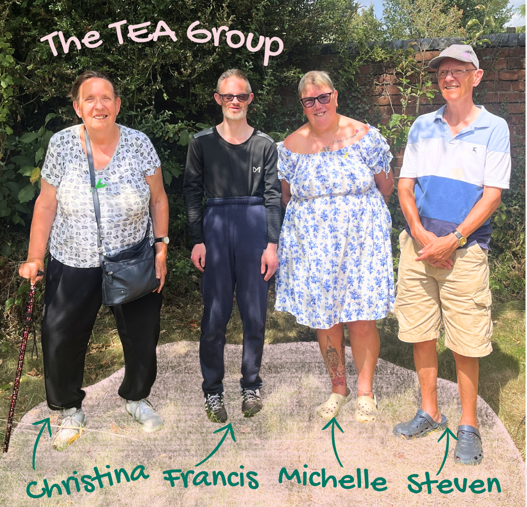 Four adults stand together outdoors in a garden area with trees and a brick wall in the background. Decorative text at the top reads “The TEA Group”. Handwritten labels with arrows at the bottom point to each person and identify them as Christina, Francis, Michelle and Steven. The image appears to be introducing members of the group.