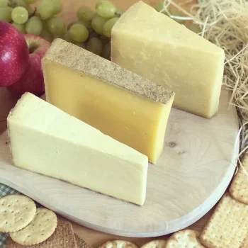 Three cheeses with fruit and crackers